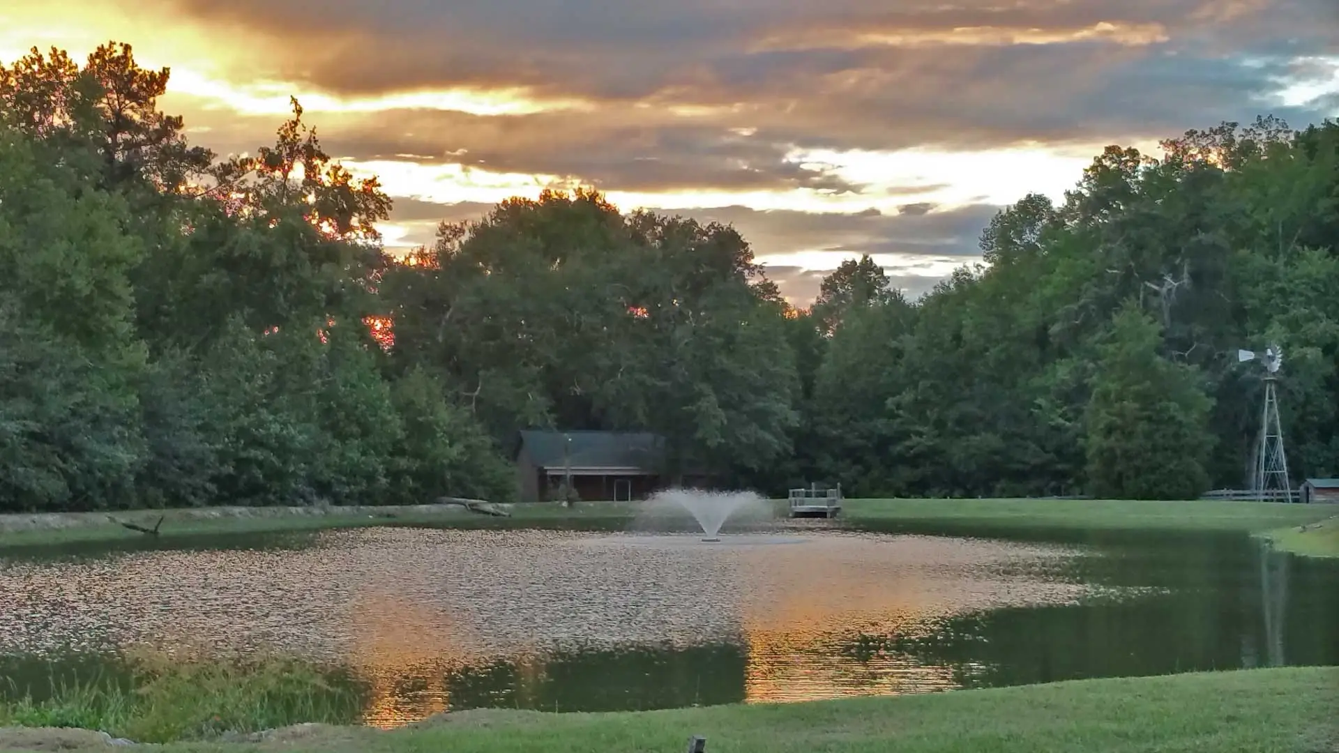 Lawn mowing and maintenance around a Grovetown, GA pond.
